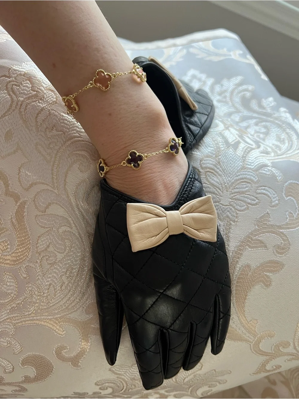 Black Quilted Leather Gloves with Beige Bow Accent